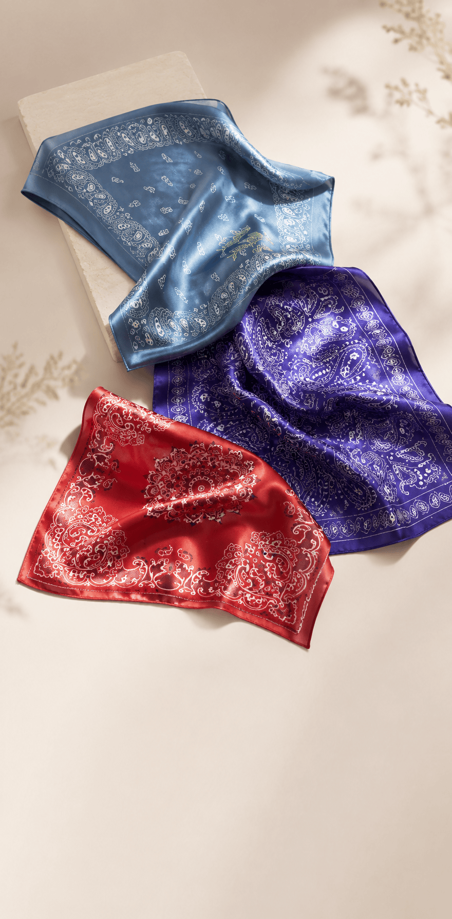 Teal paisley printed bandana laid flat, square overview