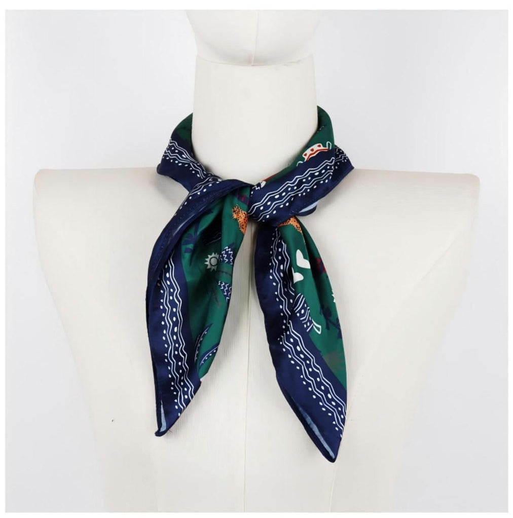 Square illustrative scarf on mannequin, green and navy border, satin hand feel