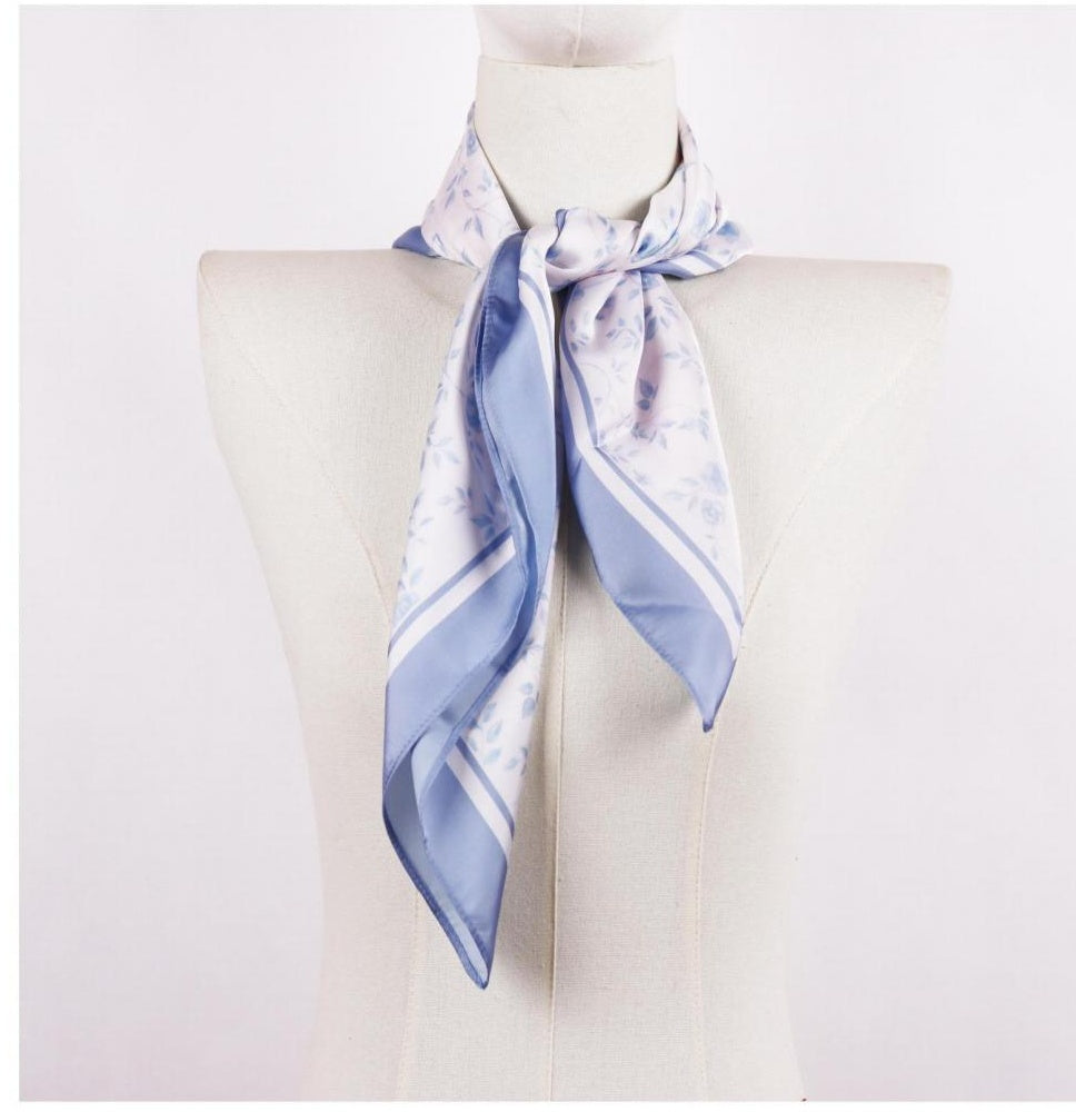 Powder blue floral square scarf on mannequin, satin hand feel