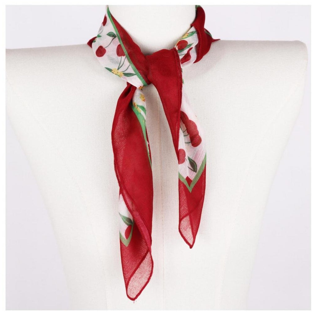 Cherry print square neck scarf on mannequin, red border