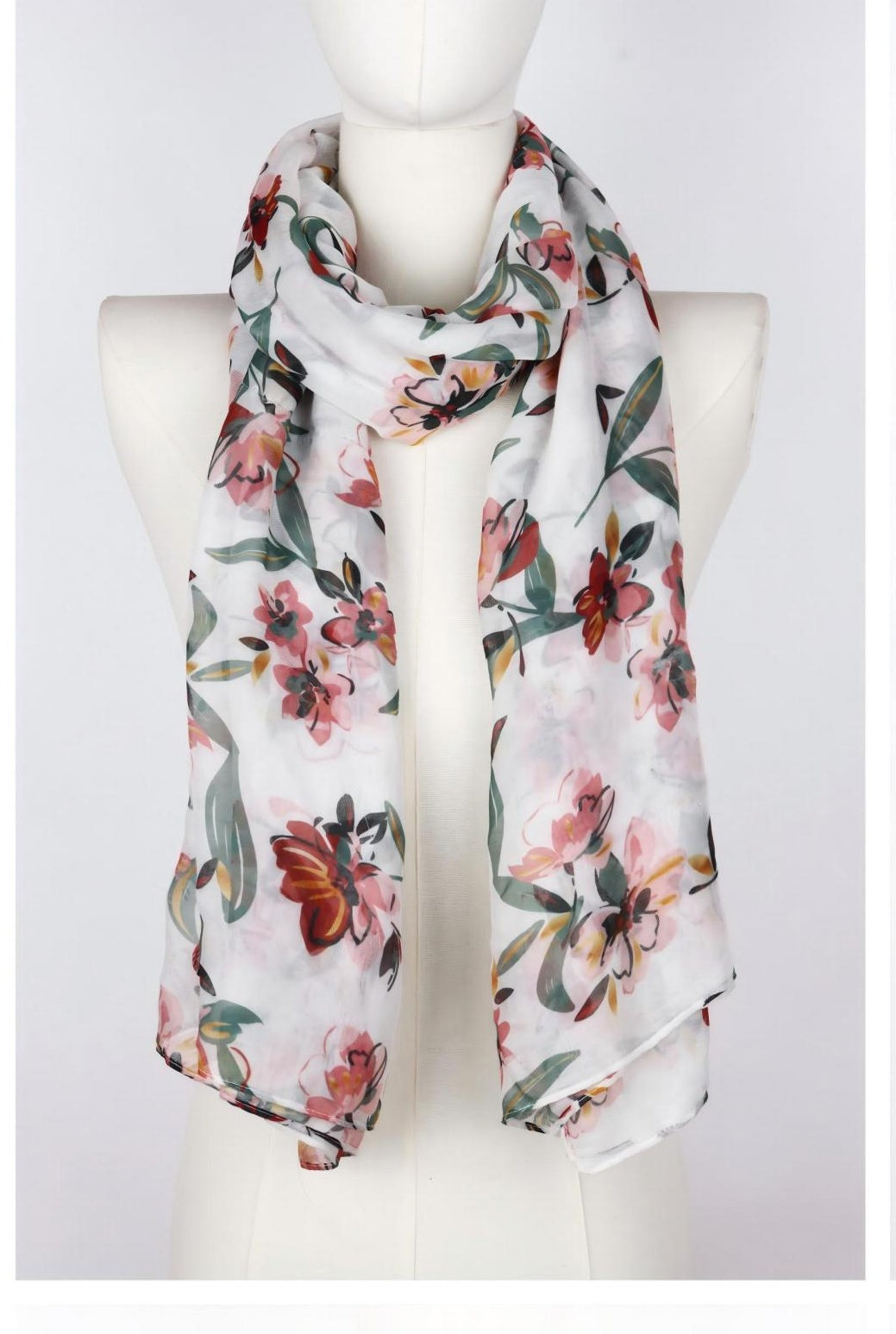 Long pink floral watercolor scarf draped on mannequin