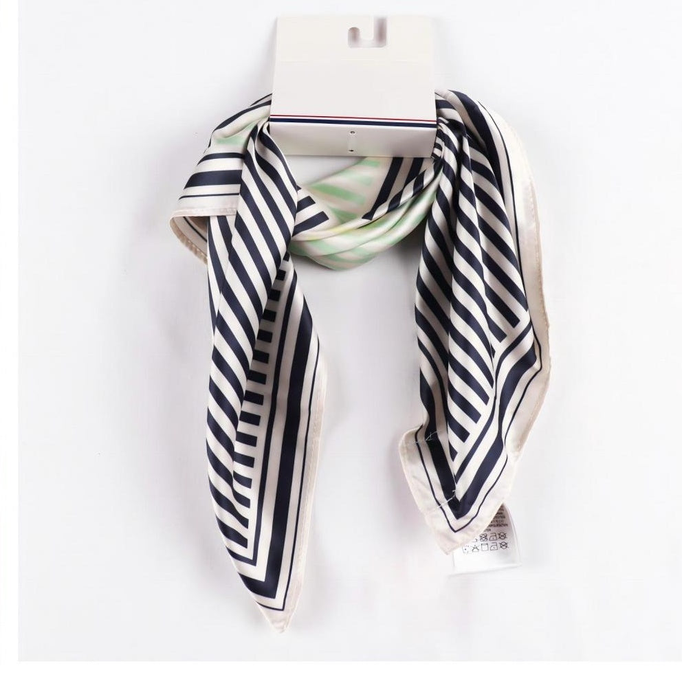 Navy and white diagonal striped square scarf on display hanger
